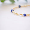 lapis beaded bracelet close up with gold beads 