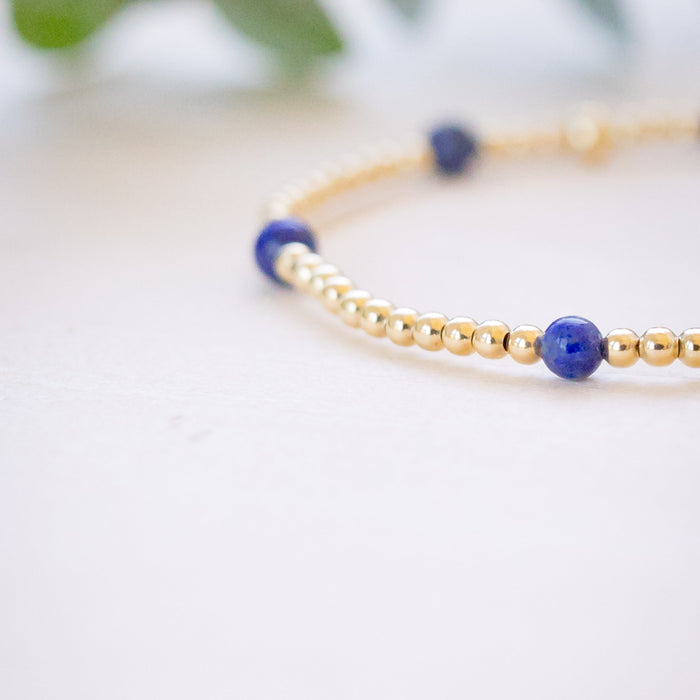lapis beaded bracelet close up with gold beads 