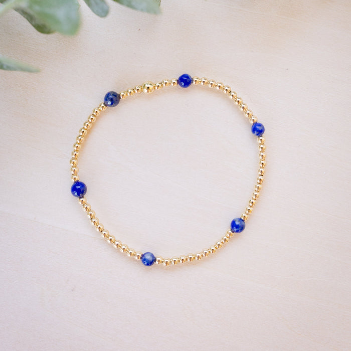 lapis beaded bracelet close up with gold beads 
