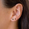 two onyx earring studs in ear