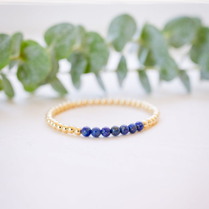 lapis beaded bracelet close up with gold beads 