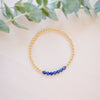 lapis beaded bracelet close up with gold beads 