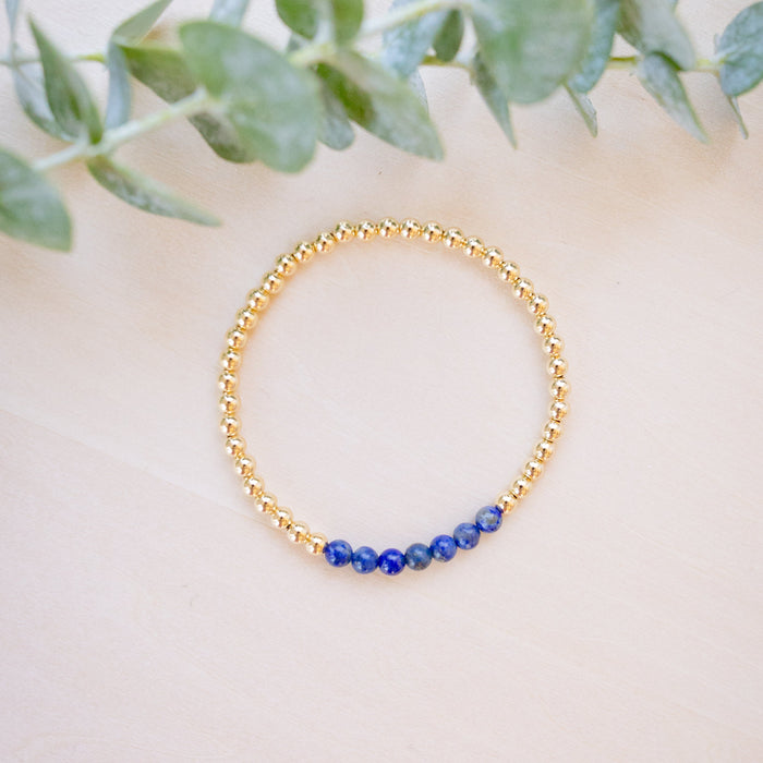 lapis beaded bracelet close up with gold beads 