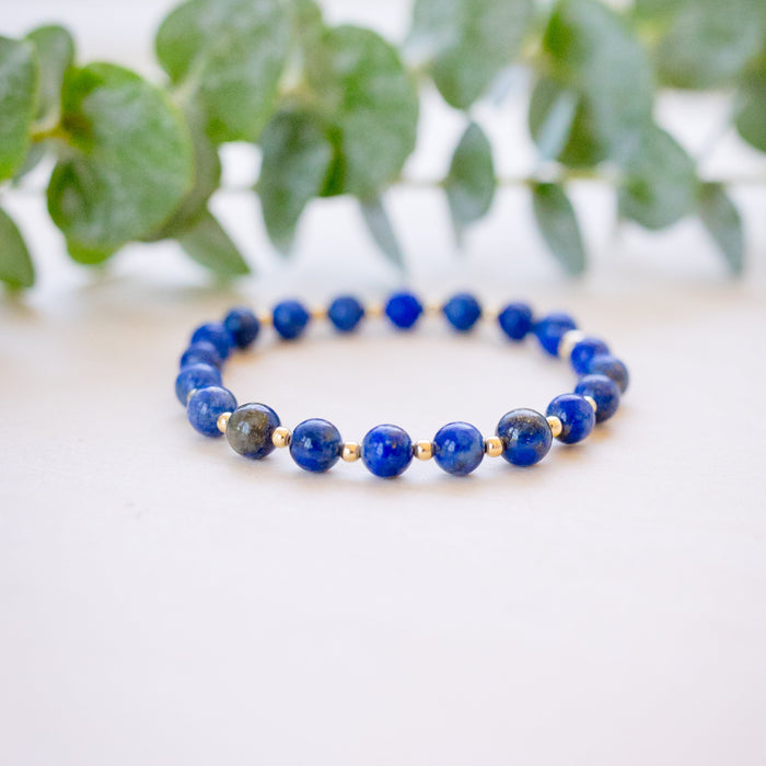 lapis beaded bracelet close up with gold beads 
