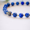 lapis beaded bracelet close up with gold beads 6mm beads details