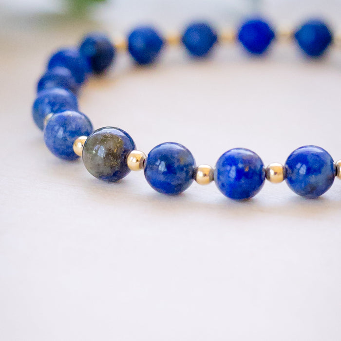 lapis beaded bracelet close up with gold beads 6mm beads details