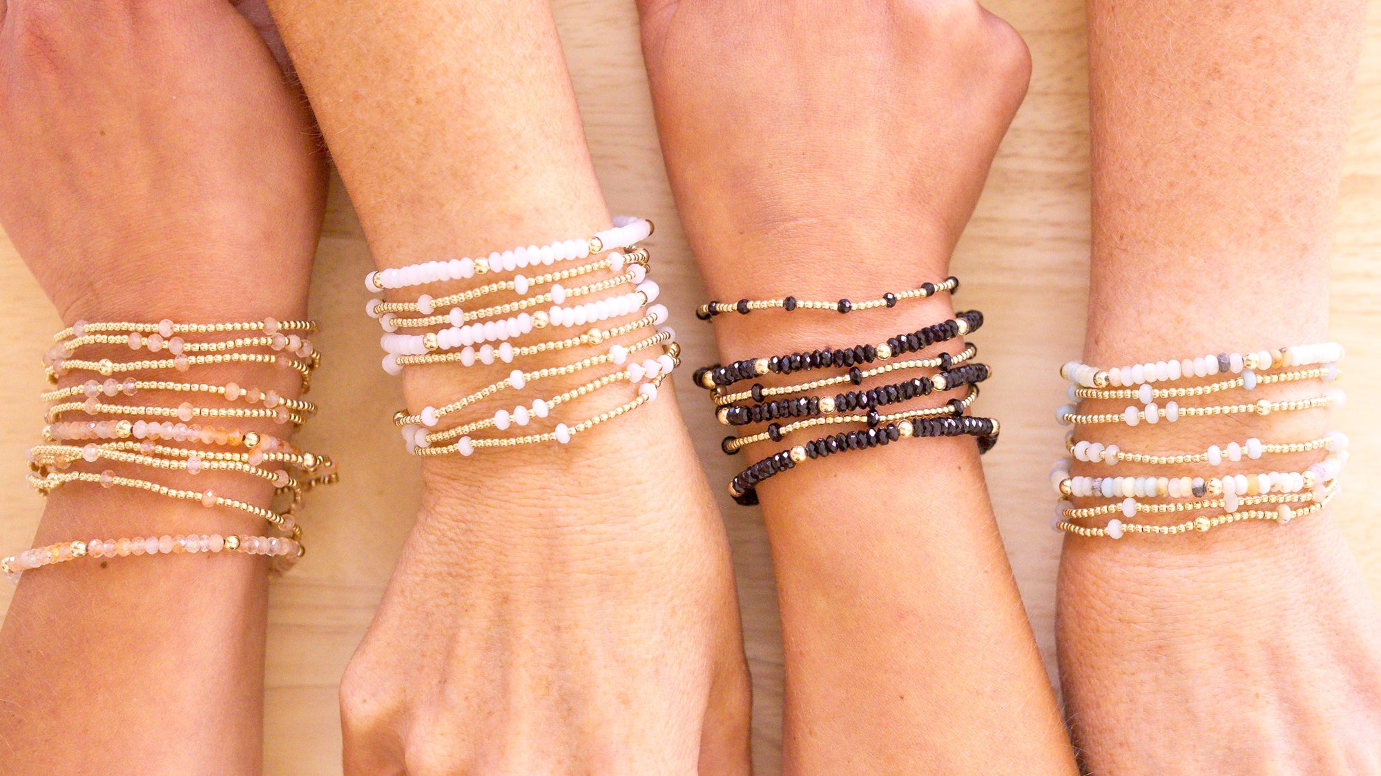 stacks on wrists on wood background