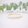 dainty gold beaded bracelet stack of four 