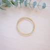 dainty gold beaded bracelet stack of four 