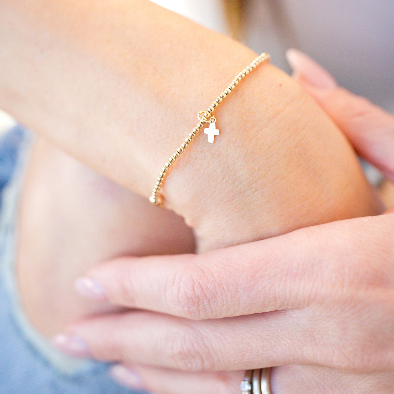 tiny cross charm beaded gold bracelet