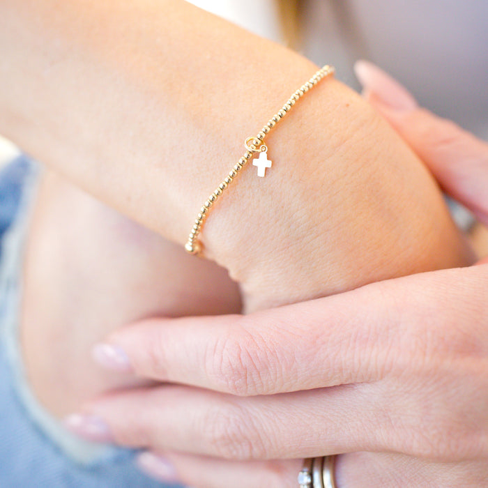tiny cross charm beaded gold bracelet