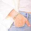 Person wearing a bracelet on a blurred background