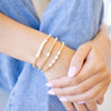 Gold beaded bracelet with freshwater pearl three bracelets stacked up