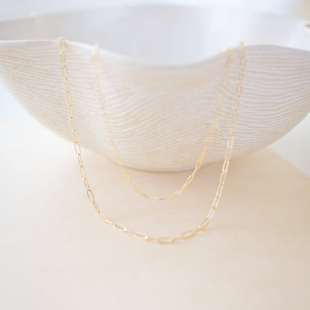 our new everyday essential ✨ A gold-filled paperclip chain that’s durable, chic, and made for daily wear—minimal or layered.