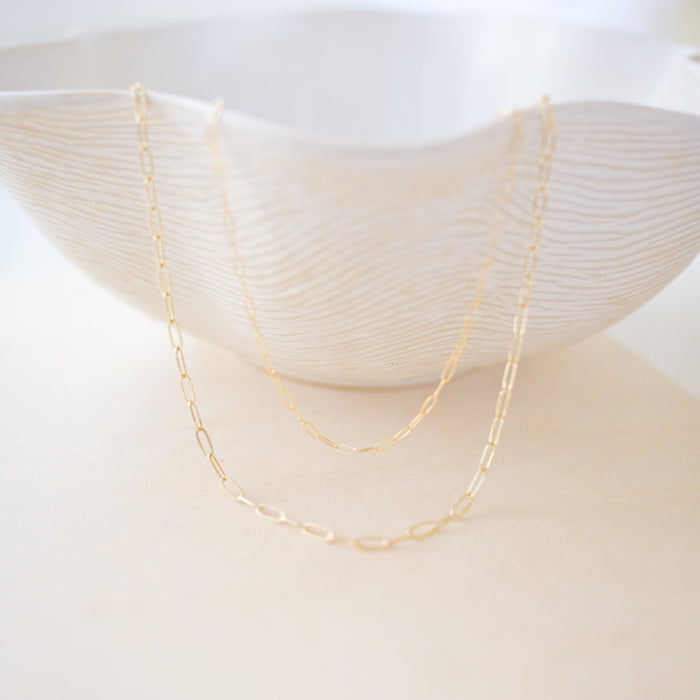 our new everyday essential ✨ A gold-filled paperclip chain that’s durable, chic, and made for daily wear—minimal or layered.