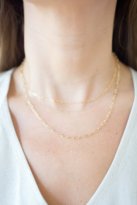 our new everyday essential ✨ A gold-filled paperclip chain that’s durable, chic, and made for daily wear—minimal or layered.