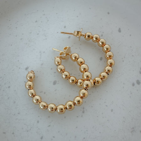Classic Gold Beaded Hoop – timeless gold-filled earrings perfect for everyday wear, stacking, or dressing up. Lightweight, versatile, and never out of style.