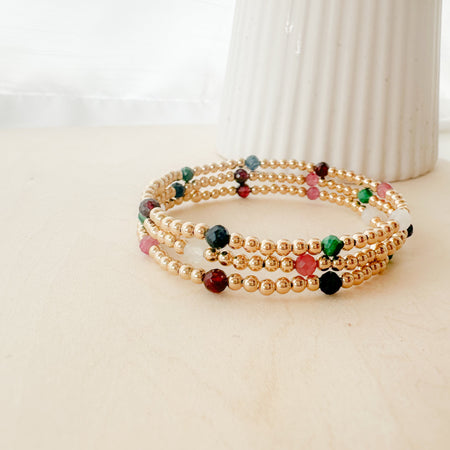 Gemma Bella Bracelet – gold-filled and natural gemstone bracelet with moonstone, malachite, sapphire, pink tourmaline, and garnet. Stackable, colorful, and festive.