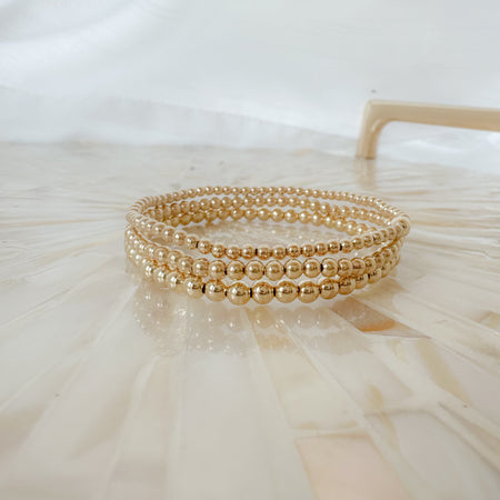 Begin your bracelet stacking journey with the Gold Starter Stack—perfect for beginners. Mix, match, and layer gold-filled bracelets for timeless, stackable everyday style.