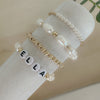 Personalized freshwater pearl bracelet with custom name, initials, or numbers. Timeless pearls + personal touch make it a meaningful gift.