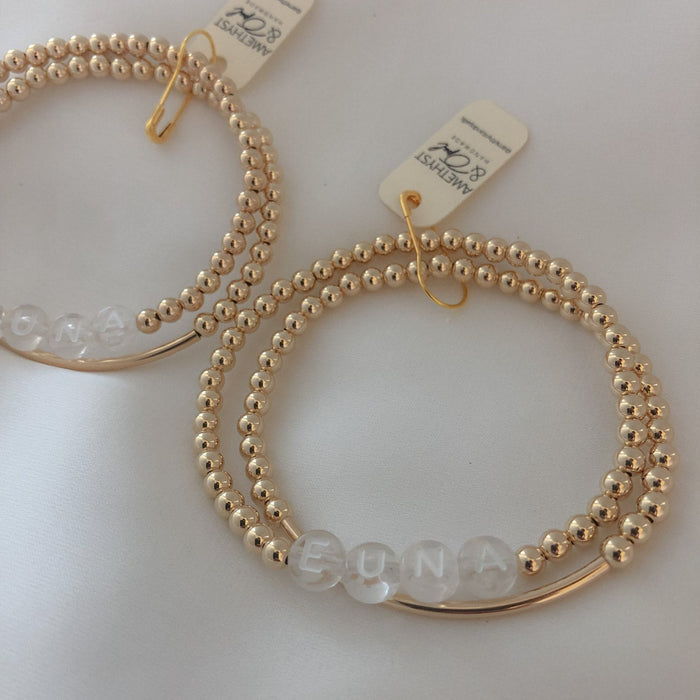 Personalized name + bar bracelet stack. Choose your letter bead color for a fully custom, stackable, everyday bracelet she’ll love.