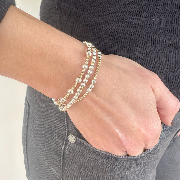 Minimalist yet luxurious, the Luxe Mixed Metal Rondelle Bracelet pairs sterling silver with golden pops. A must-have stacking bracelet for mixed metal jewelry lovers.