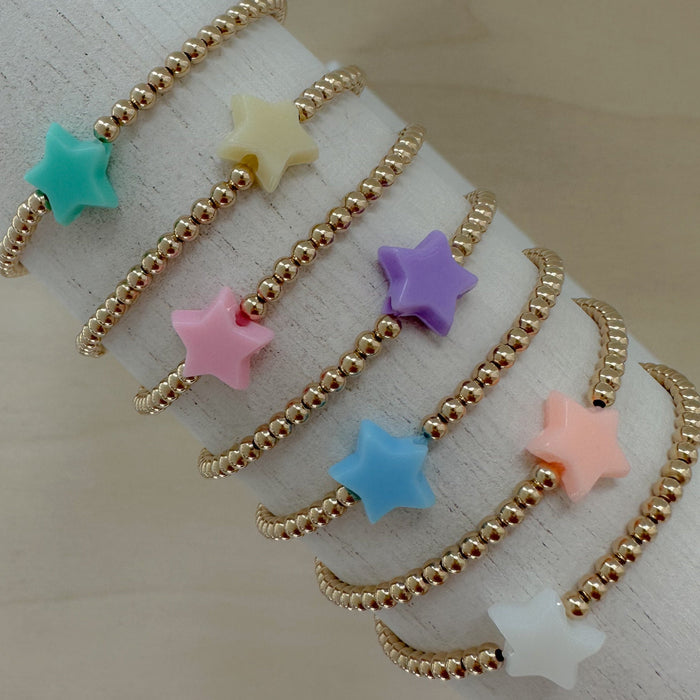 gold beaded bracelets with colorful acrylic stars