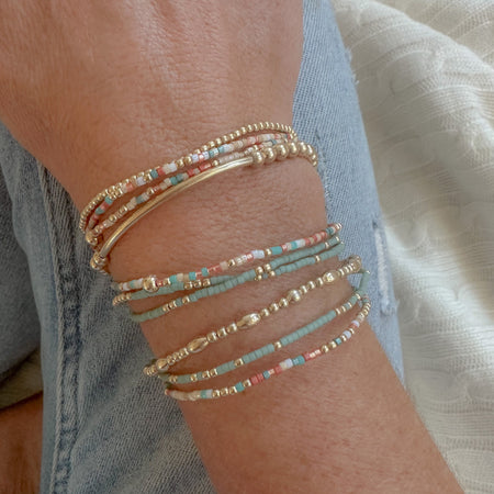 Sedona Stack: earthy, dainty bracelet set in beige, sand, sage, and terracotta—perfect for spring layering and everyday style.